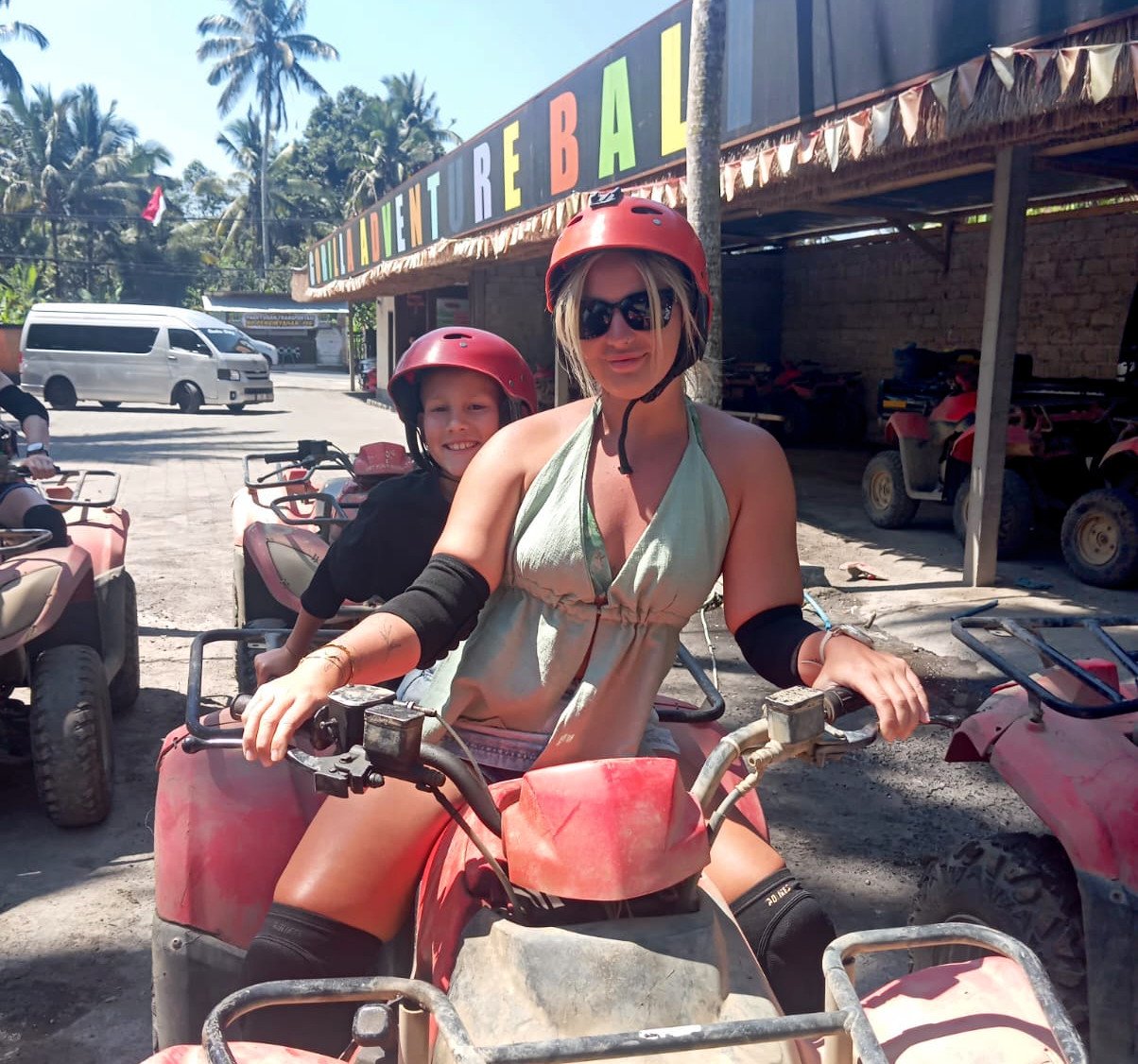 Mother and child on an ATV quad bike in Bali