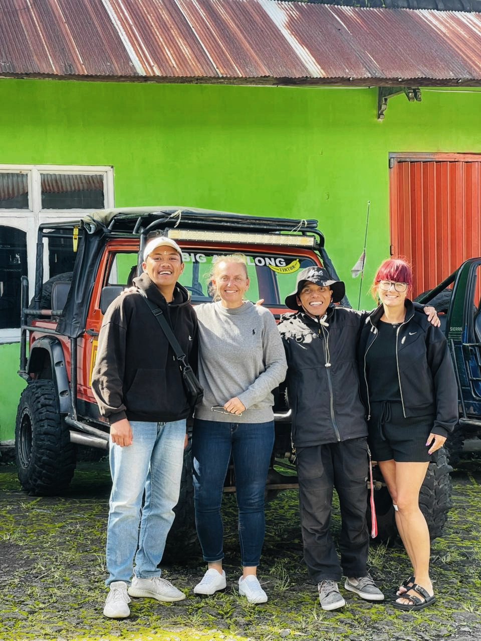 Lucky Bali guides with guests in front of 4WD jeeps